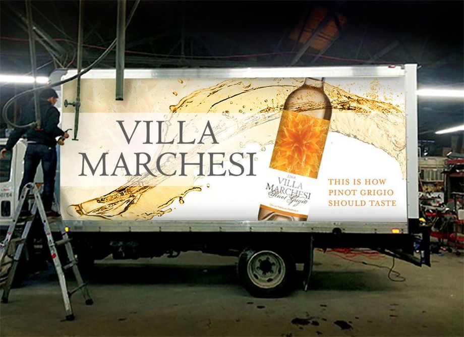 Vehicle wrap (or fleet graphics) created to promote the introduction of a private label wine in the greater Boston area.